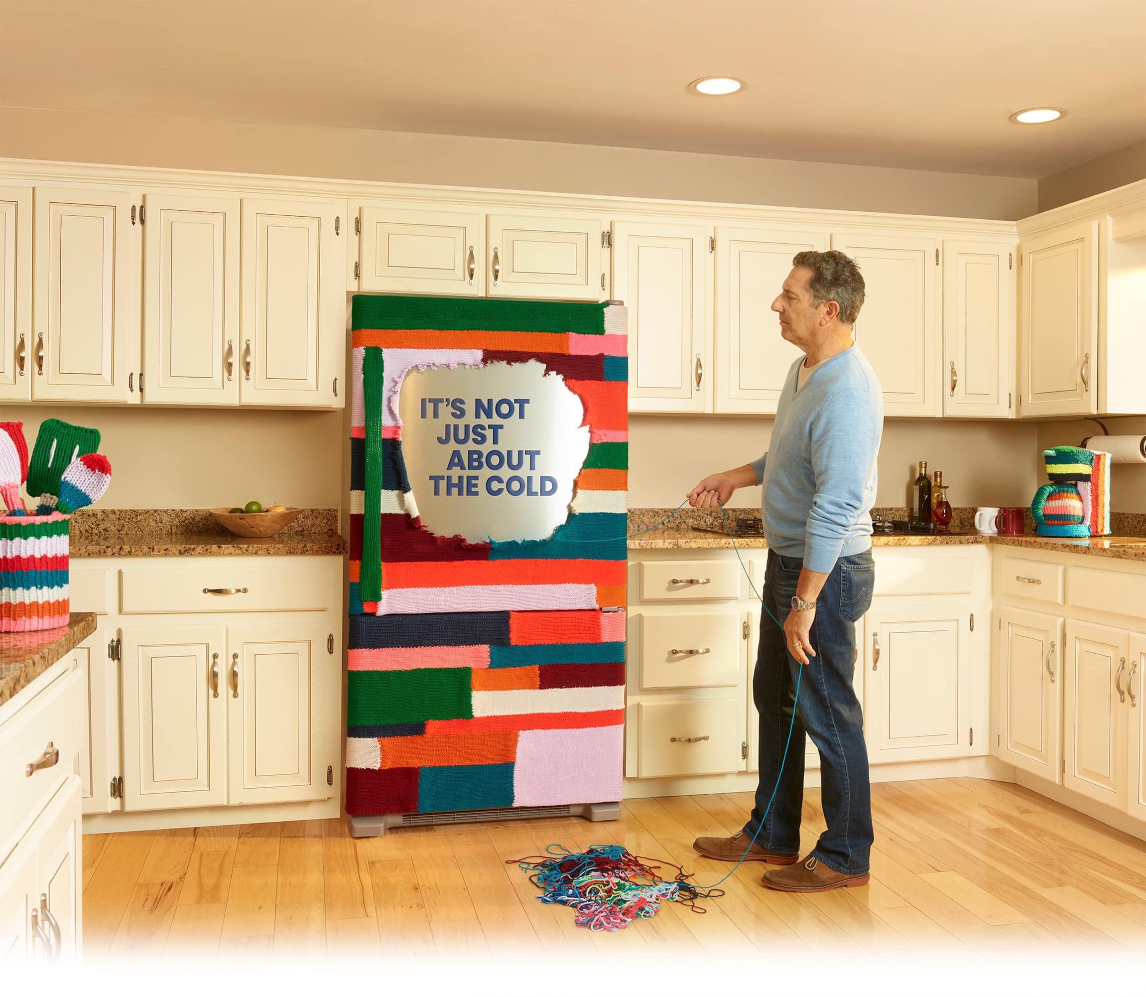 Refrigerator wrapped in yarn that says It's not just about the cold