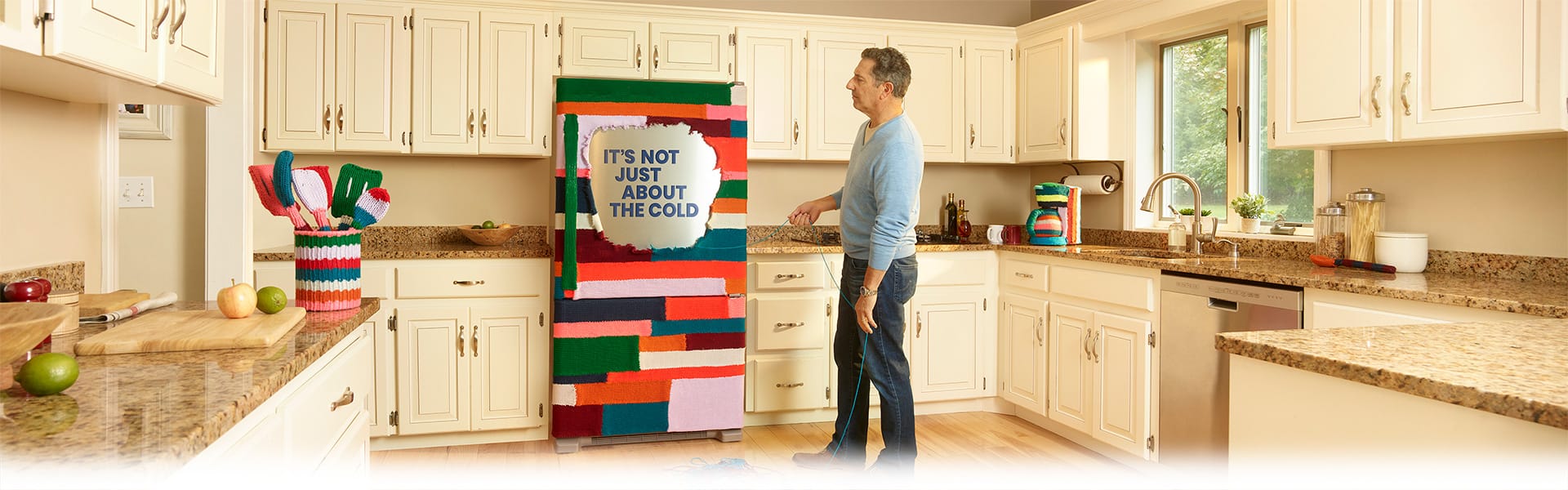 Refrigerator wrapped in yarn that says It's not just about the cold